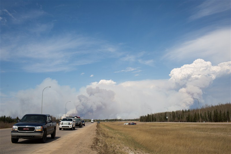 Fire rages unchecked in the heart of Canada's oil sands region as authorities race to evacuate 80,000 people. Wildfire,Wildfire rages in Fort McMurray,Wildfire in Fort McMurray,Fort McMurray,Canada's oil sands