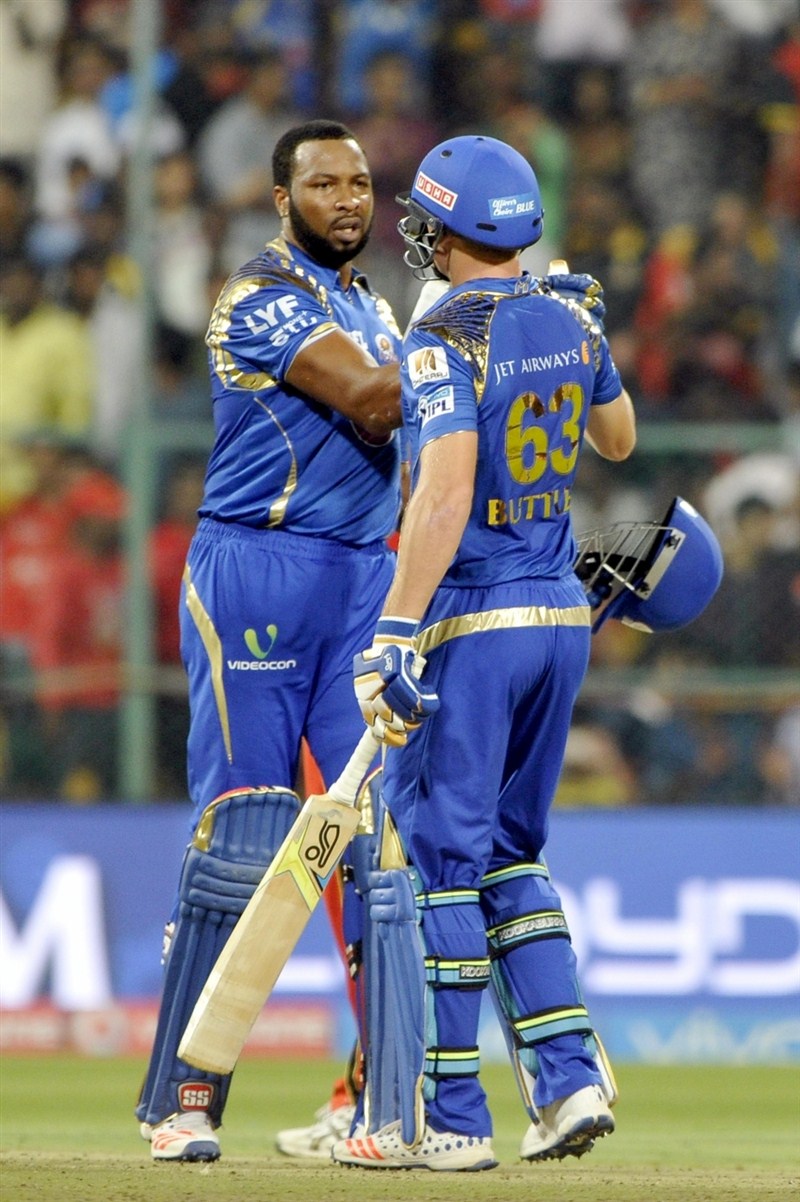 Mumbai Indians' middle order batsmen Kieron Pollard (35) and Jos Buttler (29) guided the team to a six wicket victory with eight balls to spare, in the 41st match of Indian Premier League (IPL) Season Nine match at the Chinnaswami Stadium on Wednesday. Pollard,Buttler,Mumbai Indians,Royal Challengers,Mumbai Indians beat Royal Challengers,Mumbai Indians trash Royal Challengers,Indian Premier League,Indian Premier League 2016,Indian Premier League 9,IPL 2016,IPL pics,IPL images,IPL photos,IPL stills,IPL p