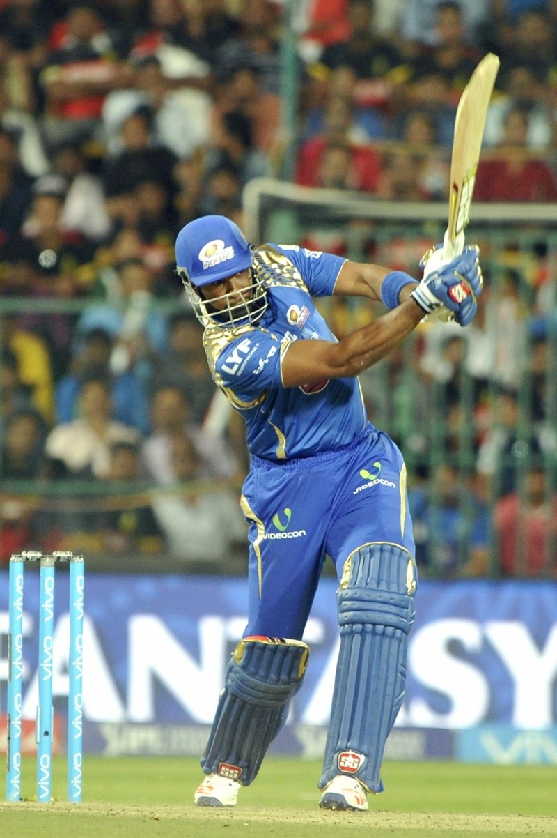 Mumbai Indians' middle order batsmen Kieron Pollard (35) and Jos Buttler (29) guided the team to a six wicket victory with eight balls to spare, in the 41st match of Indian Premier League (IPL) Season Nine match at the Chinnaswami Stadium on Wednesday. Pollard,Buttler,Mumbai Indians,Royal Challengers,Mumbai Indians beat Royal Challengers,Mumbai Indians trash Royal Challengers,Indian Premier League,Indian Premier League 2016,Indian Premier League 9,IPL 2016,IPL pics,IPL images,IPL photos,IPL stills,IPL p