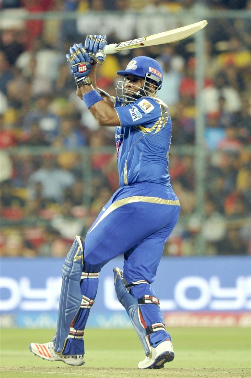 Mumbai Indians' middle order batsmen Kieron Pollard (35) and Jos Buttler (29) guided the team to a six wicket victory with eight balls to spare, in the 41st match of Indian Premier League (IPL) Season Nine match at the Chinnaswami Stadium on Wednesday. Pollard,Buttler,Mumbai Indians,Royal Challengers,Mumbai Indians beat Royal Challengers,Mumbai Indians trash Royal Challengers,Indian Premier League,Indian Premier League 2016,Indian Premier League 9,IPL 2016,IPL pics,IPL images,IPL photos,IPL stills,IPL p