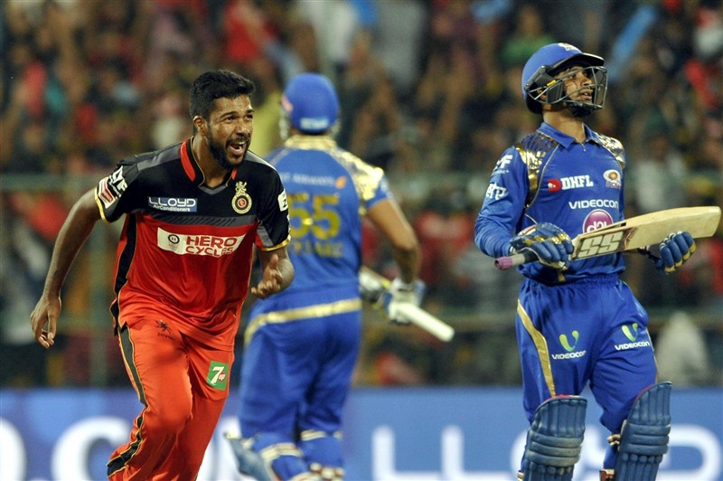 Mumbai Indians' middle order batsmen Kieron Pollard (35) and Jos Buttler (29) guided the team to a six wicket victory with eight balls to spare, in the 41st match of Indian Premier League (IPL) Season Nine match at the Chinnaswami Stadium on Wednesday. Pollard,Buttler,Mumbai Indians,Royal Challengers,Mumbai Indians beat Royal Challengers,Mumbai Indians trash Royal Challengers,Indian Premier League,Indian Premier League 2016,Indian Premier League 9,IPL 2016,IPL pics,IPL images,IPL photos,IPL stills,IPL p