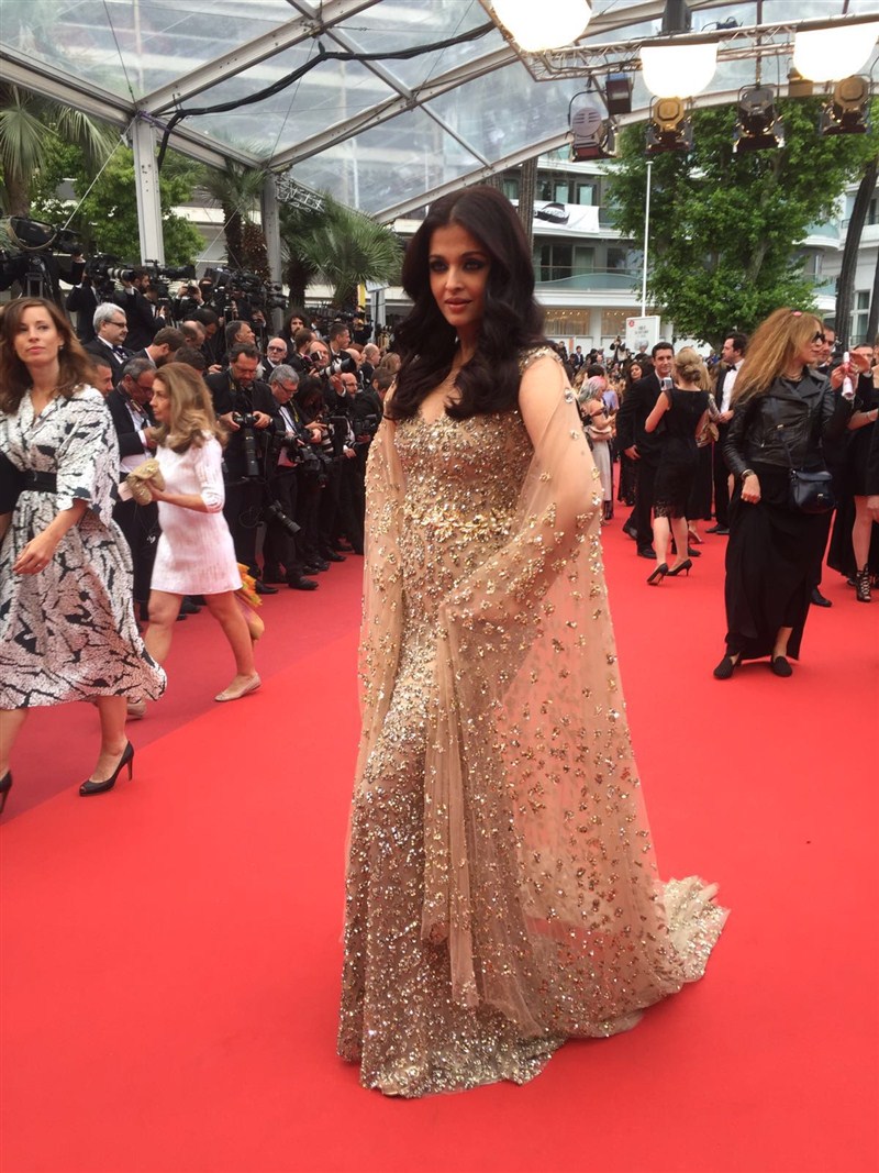 Actress Aishwarya Rai Bachchan marked her 15th year at the Cannes Film Festival with a touch of elegance and grace in a golden gown designed by Kuwait's Ali Younes. Aishwarya Rai Bachchan,Aishwarya Rai,Aishwarya Rai in golden gown,Aishwarya Rai Bachchan at Cannes Film Festival,Aishwarya Rai at Cannes Film Festival,Cannes Film Festival,Cannes Film Festival 2016,Cannes Film Festival pics,Cannes Film Festival images,Can