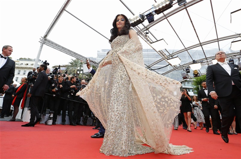 Actress Aishwarya Rai Bachchan marked her 15th year at the Cannes Film Festival with a touch of elegance and grace in a golden gown designed by Kuwait's Ali Younes. Aishwarya Rai Bachchan,Aishwarya Rai,Aishwarya Rai in golden gown,Aishwarya Rai Bachchan at Cannes Film Festival,Aishwarya Rai at Cannes Film Festival,Cannes Film Festival,Cannes Film Festival 2016,Cannes Film Festival pics,Cannes Film Festival images,Can