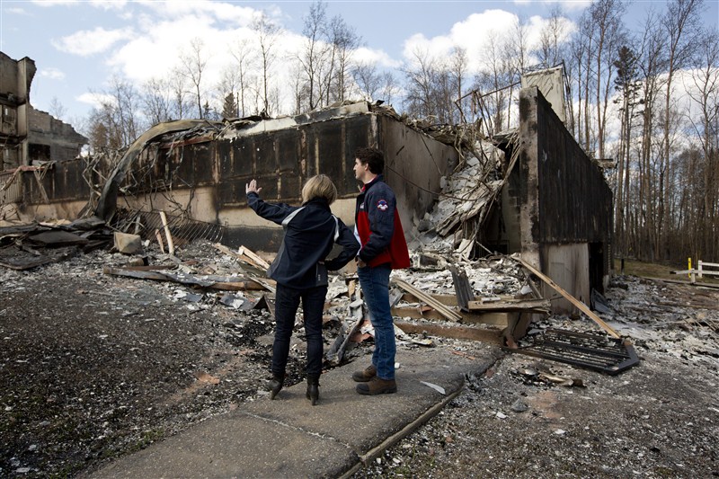 Canada's Prime Minister Justin Trudeau surveys the devastation in Fort McMurray after wildfires tore through the area. Trudeau visits Fort McMurray,Justin Trudeau,Prime Minister Justin Trudeau,Fort McMurray,Trudeau at Fort McMurray