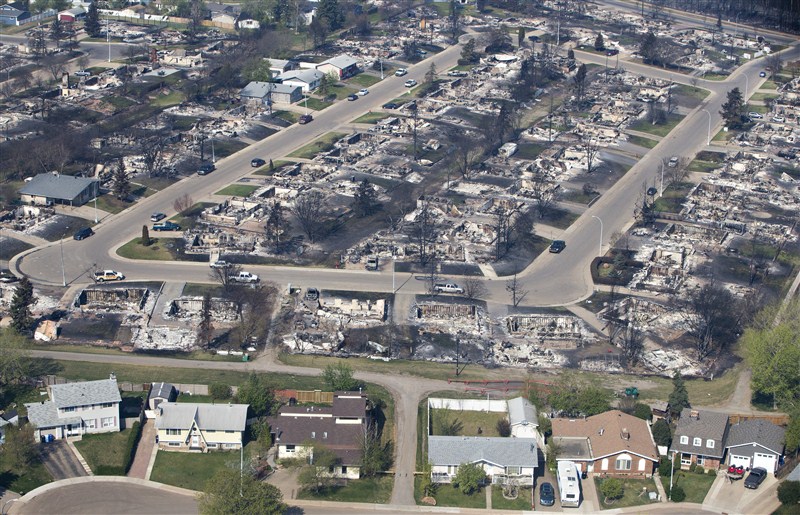 Canada's Prime Minister Justin Trudeau surveys the devastation in Fort McMurray after wildfires tore through the area. Trudeau visits Fort McMurray,Justin Trudeau,Prime Minister Justin Trudeau,Fort McMurray,Trudeau at Fort McMurray
