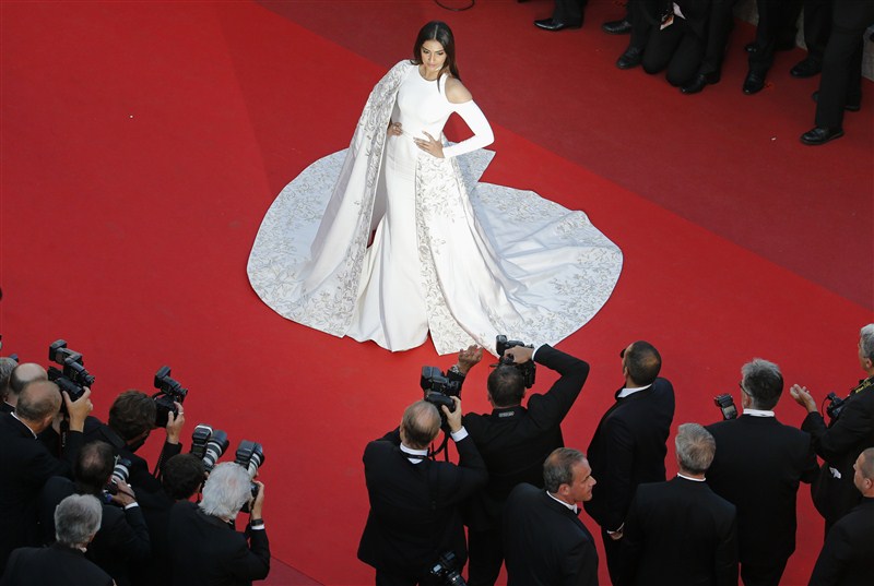 Bollywood actress Sonam Kapoor lived up to her fashionista tag as she walked the red carpet of the 69th Cannes Film Festival on Sunday in a bespoke all-white floor-sweeping gown. Sonam Kapoor,Sonam Kapoor at Cannes red carpet,Sonam Kapoor at Cannes Film Festival,Sonam Kapoor at Cannes,Bollywood actress Sonam Kapoor,Sonam Kapoor pics,Sonam Kapoor images,Sonam Kapoor stills,Sonam Kapoor pictures