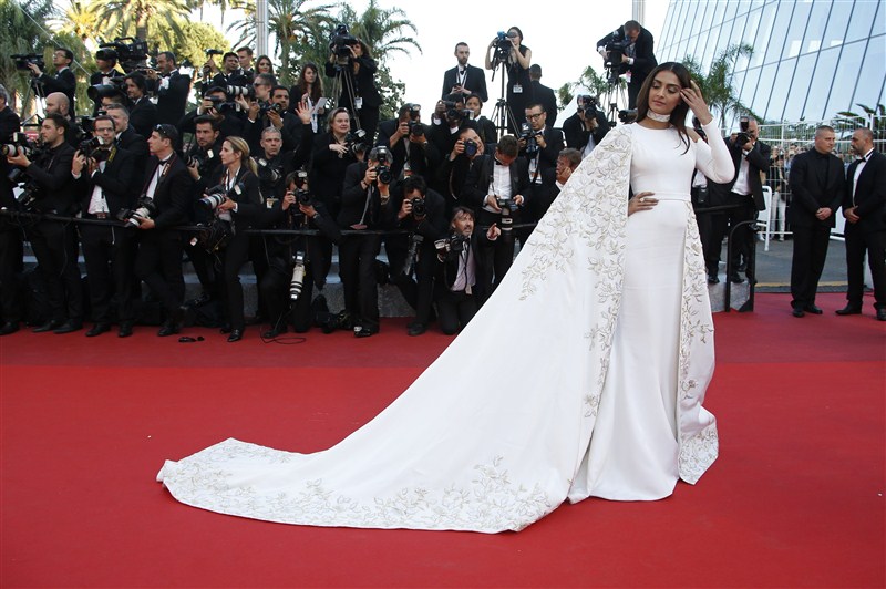 Bollywood actress Sonam Kapoor lived up to her fashionista tag as she walked the red carpet of the 69th Cannes Film Festival on Sunday in a bespoke all-white floor-sweeping gown. Sonam Kapoor,Sonam Kapoor at Cannes red carpet,Sonam Kapoor at Cannes Film Festival,Sonam Kapoor at Cannes,Bollywood actress Sonam Kapoor,Sonam Kapoor pics,Sonam Kapoor images,Sonam Kapoor stills,Sonam Kapoor pictures