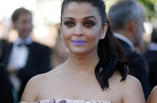 Actress Aishwarya Rai Bachchan, who has marked her 15th year at the Cannes Film Festival, stood out with a purple pout when she stepped out on the red carpet of the gala for the screening for her forthcoming film 