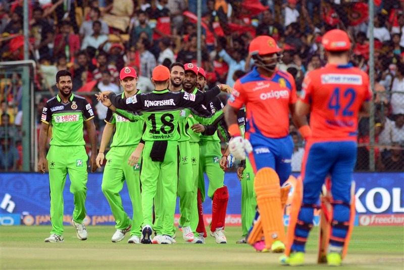 In a do-or-die match to keep their hopes alive in the Indian Premier League, Royal Challengers Bangalore (RCB) mauled Gujarat Lions (GL) by 144 runs, setting new records and sending frenzied fans into a tizzy with a double century partnership on Saturday. Royal Challengers Bangalore trash Gujarat Lions,Royal Challengers Bangalore beat Gujarat Lions,Royal Challengers Bangalore,Gujarat Lions,RCB,GL,IPL 2016,IPL pics,IPL images,IPL photos,IPL stills,IPL pictures