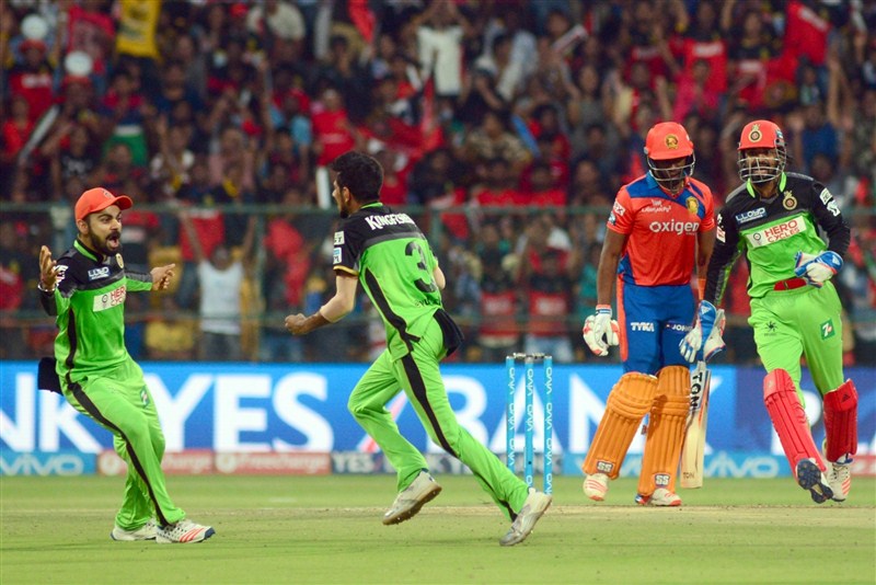 In a do-or-die match to keep their hopes alive in the Indian Premier League, Royal Challengers Bangalore (RCB) mauled Gujarat Lions (GL) by 144 runs, setting new records and sending frenzied fans into a tizzy with a double century partnership on Saturday. Royal Challengers Bangalore trash Gujarat Lions,Royal Challengers Bangalore beat Gujarat Lions,Royal Challengers Bangalore,Gujarat Lions,RCB,GL,IPL 2016,IPL pics,IPL images,IPL photos,IPL stills,IPL pictures