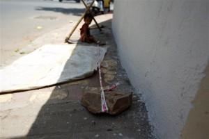 Toddler,Toddler tied to rock,Toddler tied to rock while parents work,Toddler tied,Toddler tied to stone,construction