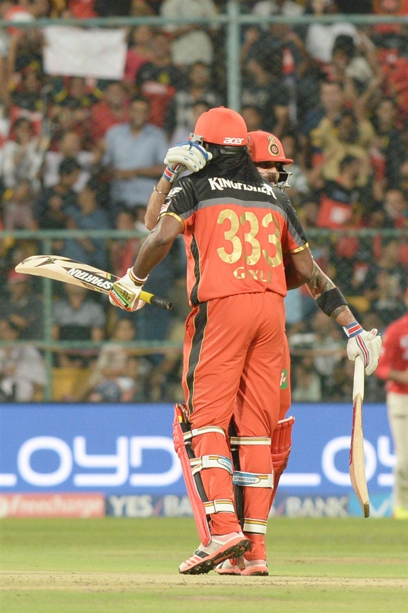 Hosts Royal Challengers Bangalore (RCB) dethroned Kings XI Punjab on early Thursday by 91 runs in a must-win league tie to keep its hopes of a place in play-offs alive in the IPL-9 season at the Chinnaswamy stadium. Royal Challengers Bangalore,Kings XI Punjab,RCB,Virat Kohli,IPL 9,IPL pics,IPL images,IPL photos,IPL stills,IPL pictures