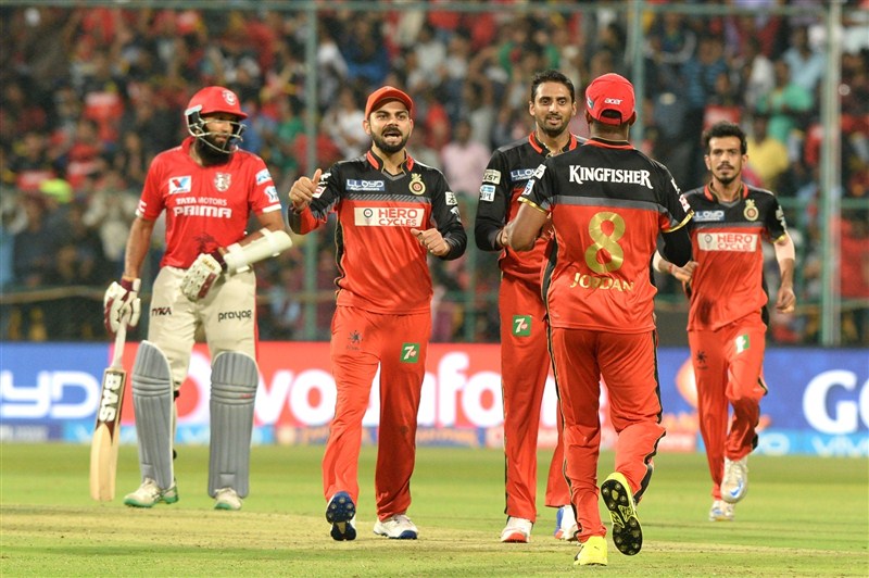 Hosts Royal Challengers Bangalore (RCB) dethroned Kings XI Punjab on early Thursday by 91 runs in a must-win league tie to keep its hopes of a place in play-offs alive in the IPL-9 season at the Chinnaswamy stadium. Royal Challengers Bangalore,Kings XI Punjab,RCB,Virat Kohli,IPL 9,IPL pics,IPL images,IPL photos,IPL stills,IPL pictures