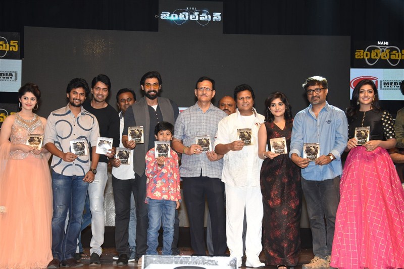 Telugu movie Gentleman Audio Launch held in Hyderabad. Celebs like Nani, Surabhi, Rana Daggubati and others graced the event. Gentleman Audio Launch,Gentleman,Gentleman Audio,Telugu movie Gentleman,Nani's Gentleman Audio Launch,Nani,Surabhi,Niveda Thomas,Sri Mukhi,Eesha,Mohan Krishna Indraganti,Mani Sharma,Rana Daggubati,Gentleman Audio Launch pics,Gentleman Audio Launch im