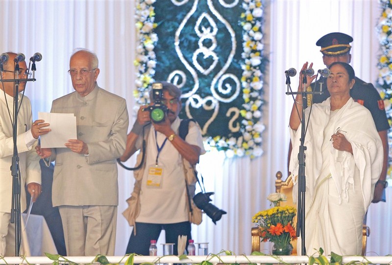 Trinamool Congress supremo Mamata Banerjee sworn as West Bengal chief minister for the second time on Friday. Mamata Banerjee,Mamata Banerjee takes oath as Chief Minister of West Bengal,Mamata Banerjee takes oath,Mamata Banerjee as Chief Minister of West Bengal,Mamata Banerjee as Chief Minister,West Bengal,Mamata Banerjee pics,Mamata Banerjee images,Mamata Banerj