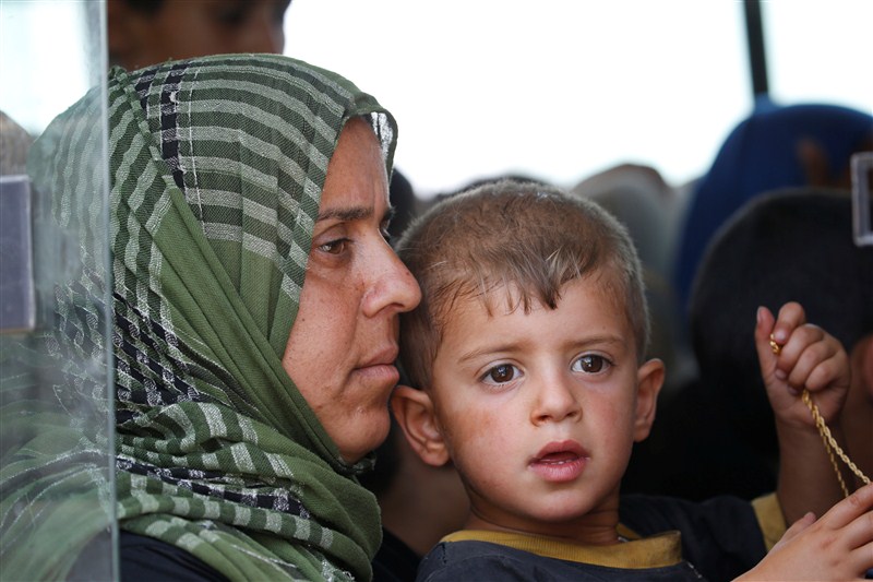 A boat carrying fleeing civilians across a river from Falluja sank, killing at least four people, as pro-Baghdad forces almost completely encircled the Islamic State stronghold. Islamic State Militants,Islamic State,Civilians Fleeing Fallujah,Fleeing Fallujah,Falluja sank,pro-Baghdad,Islamic State stronghold