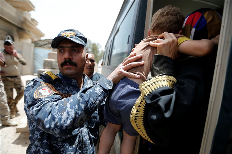 A boat carrying fleeing civilians across a river from Falluja sank, killing at least four people, as pro-Baghdad forces almost completely encircled the Islamic State stronghold. Islamic State Militants,Islamic State,Civilians Fleeing Fallujah,Fleeing Fallujah,Falluja sank,pro-Baghdad,Islamic State stronghold