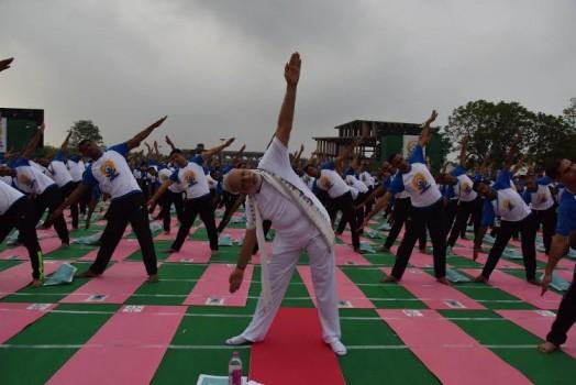 Thousands of people across the country began the day on Tuesday with yoga exercises to mark the second International Yoga Day.