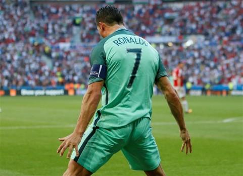 Captain Cristiano Ronaldo scored twice in the second half as Portugal managed to hold Hungary 3-3 in a Group F match and qualified for the pre-quarterfinals of the Euro football championship on Wednesday.