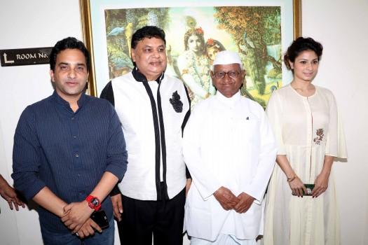 Social activist Anna Hazare and Bollywood actor Tanishaa Mukerji during the poster launch of film Anna, in Mumbai.
