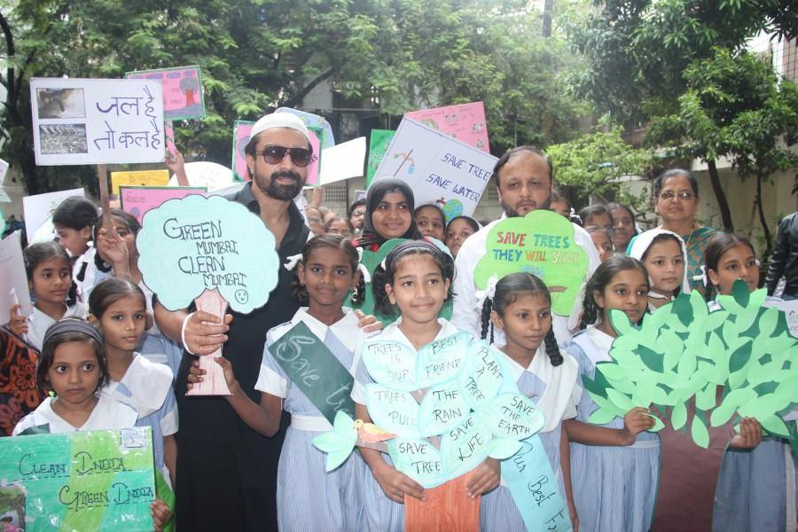 Philanthropist Asif Bhamla and Ajaz Khan at 'Van Mahotsav Week' tree plantation drive in association with Bhamla Foundation & Anjuman Islam Girls School, Bandra. Bhamla Foundation,Ajaz Khan,Van Mahotsav Week,Philanthropist Asif Bhamla,tree plantation,planting tree,Anjuman Islam Girls School