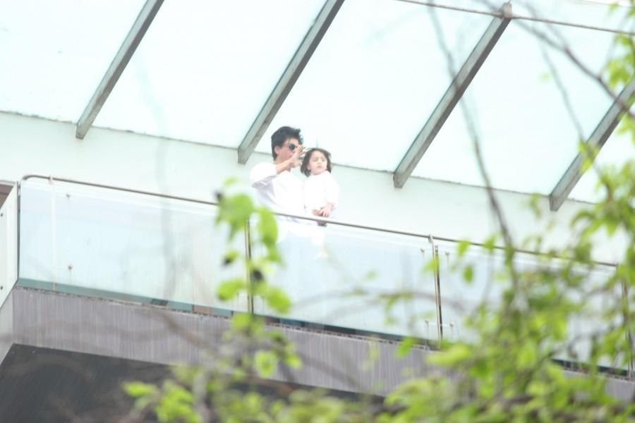 Bollywood actor Shah Rukh Khan, son AbRam greet fans on Eid at Mannat. Shah Rukh Khan,Shah Rukh Khan,son AbRam greet fans on Eid at Mannat,Shah Rukh Khan with son AbRam,AbRam,Shah Rukh Khan celebrates Eid,Shah Rukh Khan celebrates Eid at Mannat,Shah Rukh Khan latest pics,Shah Rukh Khan latest images,Shah Rukh Khan latest ph