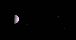 NASA's Juno spacecraft has sent the first-ever image of the gas giant Jupiter and three of its four moons to the Earth as it continues orbiting the planet.
