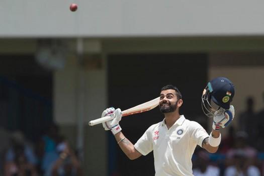 Virat Kohli completed a superb double century as India posted 404/4 at lunch on the second day of the first Test at the Sir Vivian Richards Stadium here on Friday.