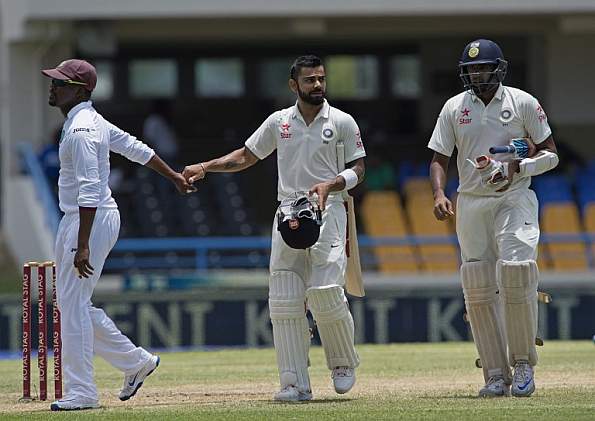 Virat Kohli completed a superb double century as India posted 404/4 at lunch on the second day of the first Test at the Sir Vivian Richards Stadium here on Friday. Virat Kohli,Virat Kohli hits maiden double century,Virat Kohli hits double century,Virat Kohli double century,Sir Vivian Richards Stadium,Virat Kohli 200,Virat Kohli in Antigua,Virat Kohli pics,Virat Kohli images,Virat Kohli photos,Virat Kohli stills,Vira