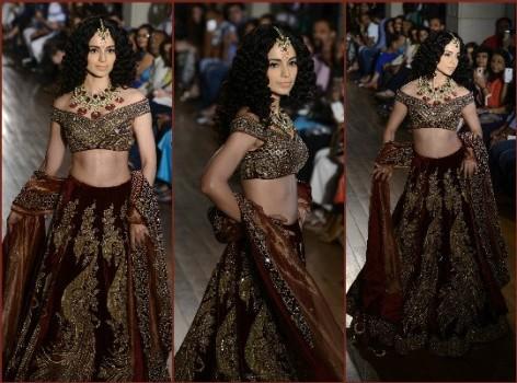 Actress Kangana Ranaut looked every inch a Mughal empress as she walked for Manav Gangwani in his creation from his latest collection titled Begum-e-Jannat at the FDCI India Couture Week 2016 here on Sunday.