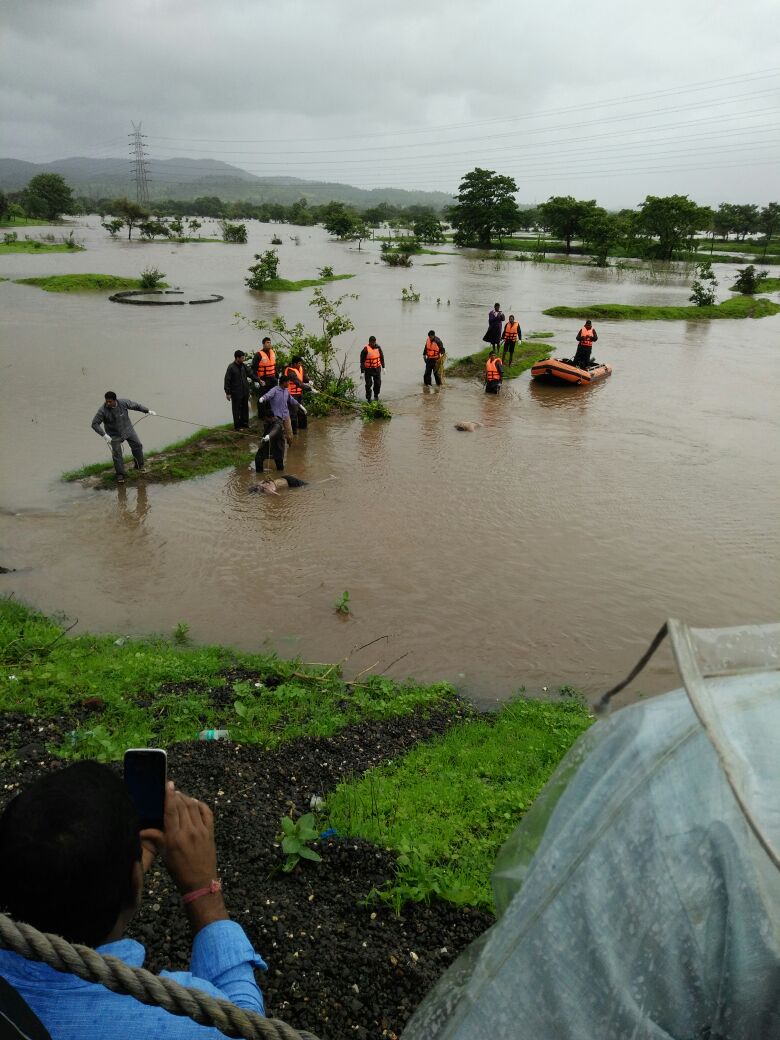 At least two buses with about 22 passengers were washed away early on Wednesday in flood waters after a bridge collapse on the Mumbai-Goa Highway, an official said. Mumbai-Goa highway bridge collapse,bridge collapse,highway bridge collapse,flood waters,bridge collapse in Mumbai-Goa Highway,bridge collapse in Mumbai Highway,bridge collapse in Goa Highway