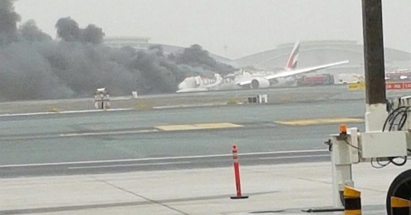 An Emirates plane flying from Kerala with 275 people on board caught fire after landing here on Wednesday, leaving the passengers and crew shaken and many injured, witnesses and officials said. A part of the engine of the Boeing 777 appeared to have fallen off after the violent landing at the Dubai International Airport, which was immediately shut for all landings and take-offs. Emirates flight crash,Emirates flight crash at Dubai Airport,Emirates flight,flight crash,Dubai Airport