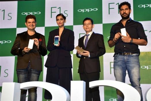 Indian cricket player Yuvraj Singh and Bollywood actor Sonam Kapoor during the launch of Oppo F1S smartphone.
