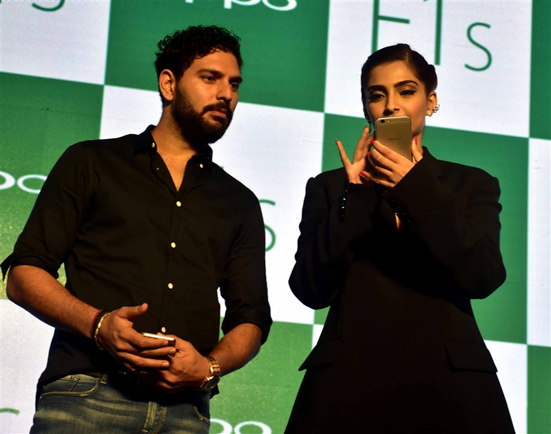 Indian cricket player Yuvraj Singh and Bollywood actor Sonam Kapoor during the launch of Oppo F1S smartphone. Sonam Kapoor,Yuvraj Singh,Oppo F1s Smartphone Launch,Oppo F1s Smartphone,Oppo F1s,cricket player Yuvraj Singh,Oppo F1s launch,Oppo F1s launch pics,Oppo F1s launch images,Oppo F1s launch photos,Oppo F1s launch stills,Oppo F1s launch pictures