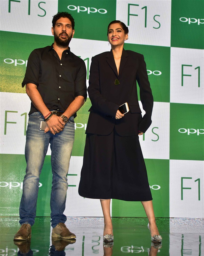 Indian cricket player Yuvraj Singh and Bollywood actor Sonam Kapoor during the launch of Oppo F1S smartphone. Sonam Kapoor,Yuvraj Singh,Oppo F1s Smartphone Launch,Oppo F1s Smartphone,Oppo F1s,cricket player Yuvraj Singh,Oppo F1s launch,Oppo F1s launch pics,Oppo F1s launch images,Oppo F1s launch photos,Oppo F1s launch stills,Oppo F1s launch pictures