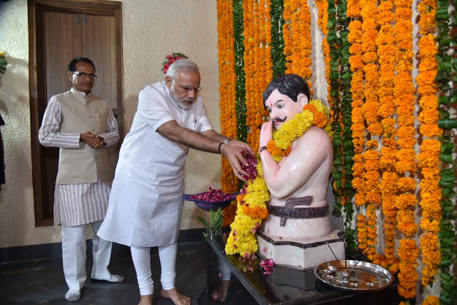Prime Minister Narendra Modi on Tuesday paid homage to Chandrashekar Azad at the freedom fighter's birthplace Bhabra in Madhya Pradesh and became the first Prime Minister to visit the village. Prime Minister Narendra Modi,Narendra Modi,Chandrashekhar Azad,freedom fighter,Madhya Pradesh,PM Modi,PM Narendra Modi,first Prime Minister