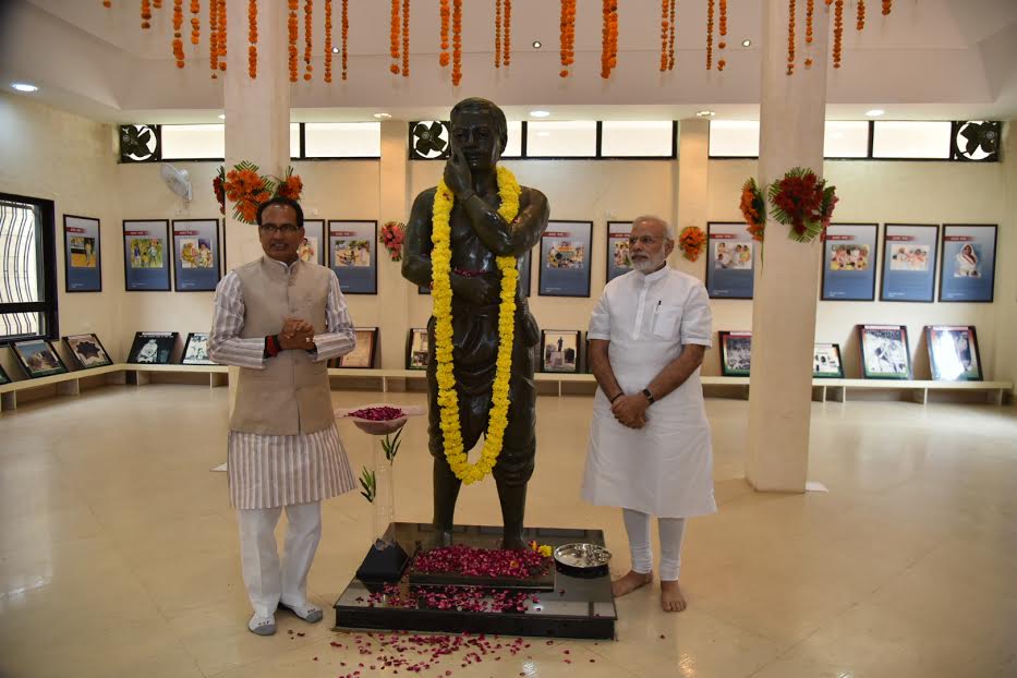 Prime Minister Narendra Modi on Tuesday paid homage to Chandrashekar Azad at the freedom fighter's birthplace Bhabra in Madhya Pradesh and became the first Prime Minister to visit the village. Prime Minister Narendra Modi,Narendra Modi,Chandrashekhar Azad,freedom fighter,Madhya Pradesh,PM Modi,PM Narendra Modi,first Prime Minister