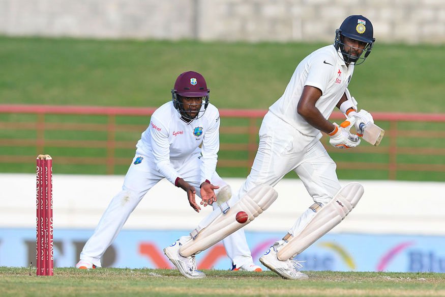 With an unbeaten 108-run sixth wicket partnership, Ravichandran Ashwin and wicket-keeper Wriddhaman Saha brought India back into the game to post 234 for 5 wickets against a domineering West Indies on the first day of the third Test at the Darren Sammy National Cricket Stadium here on Tuesday. Ravichandran Ashwin,Wriddhaman Saha,Ashwin,Saha,Ind vs WI,Ind vs WI test match,Ind vs WI 3rd test match,Ind vs WI third test match,Ind vs WI third Test,Test Cricket