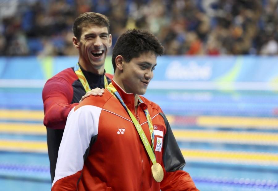 Joseph Schooling won Singapore's first gold medal of the ongoing Rio Olympics by ending multiple Olympic gold medallist Michael Phelps hegemony in the 100m butterfly here. The 21-year-old Schooling touched the wall in 50.39 seconds, 0.75sec ahead of Phelps at the Olympic Aquatics Stadium here on Friday evening, reports Xinhua. Joseph Schooling,Michael Phelps,Joseph Schooling beats Michael Phelps,Rio Olympics,Rio Olympics 2016