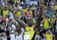 Two-time reigning sprint champion Usain Bolt won his qualifying heat in the men's 100 metres easily at the Rio Olympics here on Saturday.