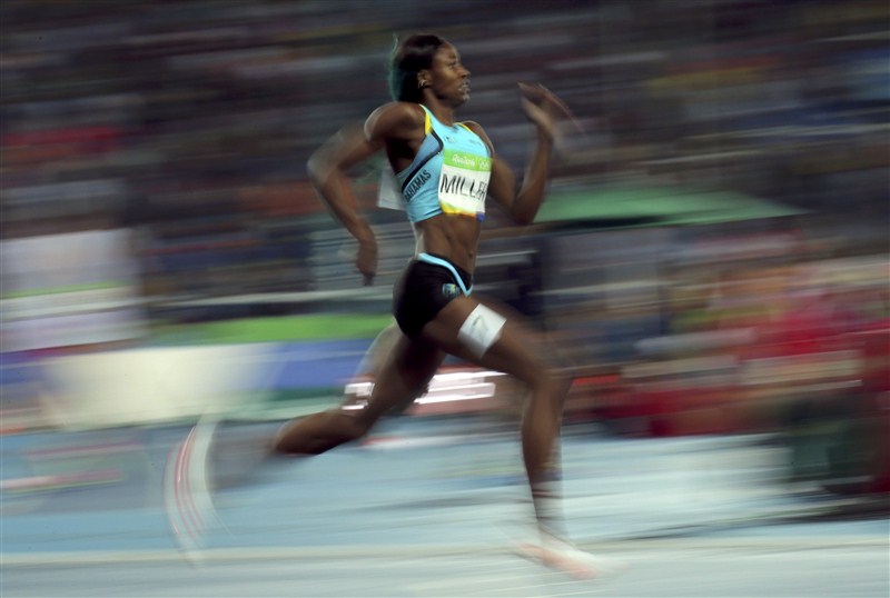 Shaunae Miller of the Bahamas launched herself over the finishing line to beat Allyson Felix to the women's Olympic 400 meters gold medal. Shaunae Miller,Shaunae Miller dives for 400m gold,Shaunae Miller 400m gold,Shaunae Miller gets gold,Olympic 400 meters gold medal,gold medal,Rio Olympics 2016,Rio Olympics winner