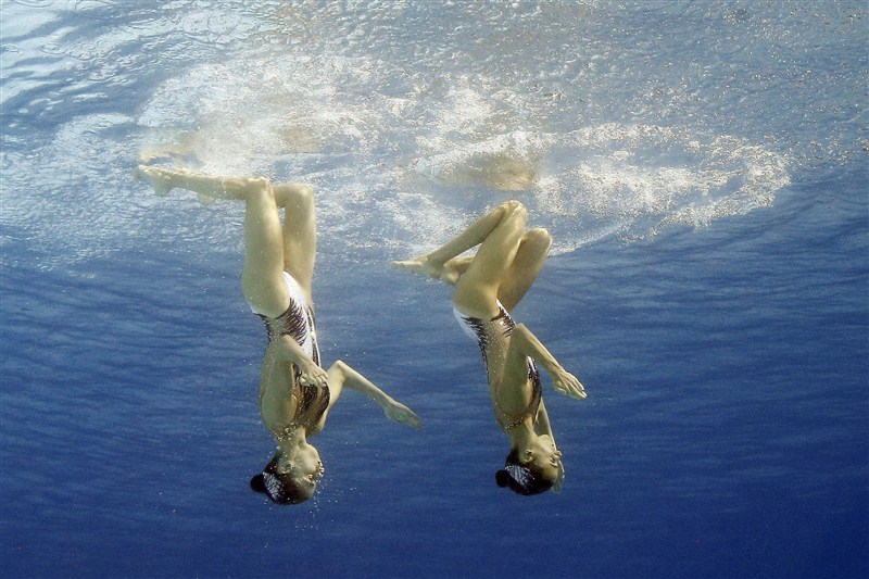 Synchronized swimmers reveal complex coordination under the water's surface at the Rio Olympics. Dancing beneath the water,swimmers,water surface,Under Water Dancing,Rio Olympics 2016,Rio Olympics,Rio Olympics pics,Rio Olympics images,Rio Olympics photos,Rio Olympics stills,Rio Olympics pictures