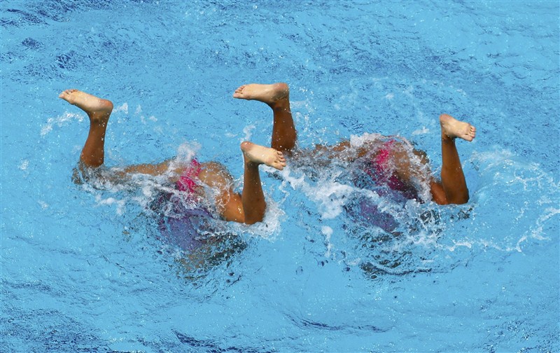 Synchronized swimmers reveal complex coordination under the water's surface at the Rio Olympics. Dancing beneath the water,swimmers,water surface,Under Water Dancing,Rio Olympics 2016,Rio Olympics,Rio Olympics pics,Rio Olympics images,Rio Olympics photos,Rio Olympics stills,Rio Olympics pictures