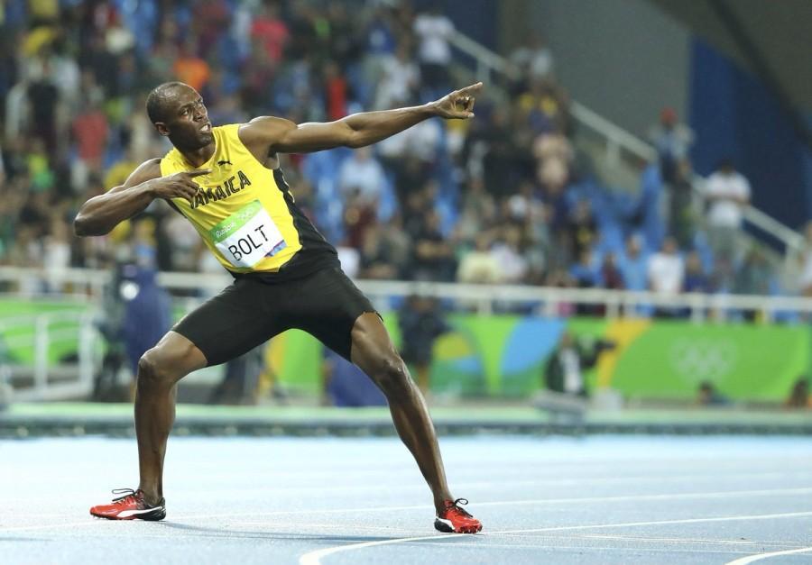 Usain Bolt won the men's 200 metres title at a third consecutive Olympics with a dominant performance and moved another step closer to his target of clinching three gold medals at the Rio Games here. Usain Bolt,Usain Bolt wins 200m title,Rio Olympics,Usain Bolt third consecutive Olympics title,Usain Bolt winner,Usain Bolt pics,Usain Bolt images,Usain Bolt photos,Usain Bolt stills