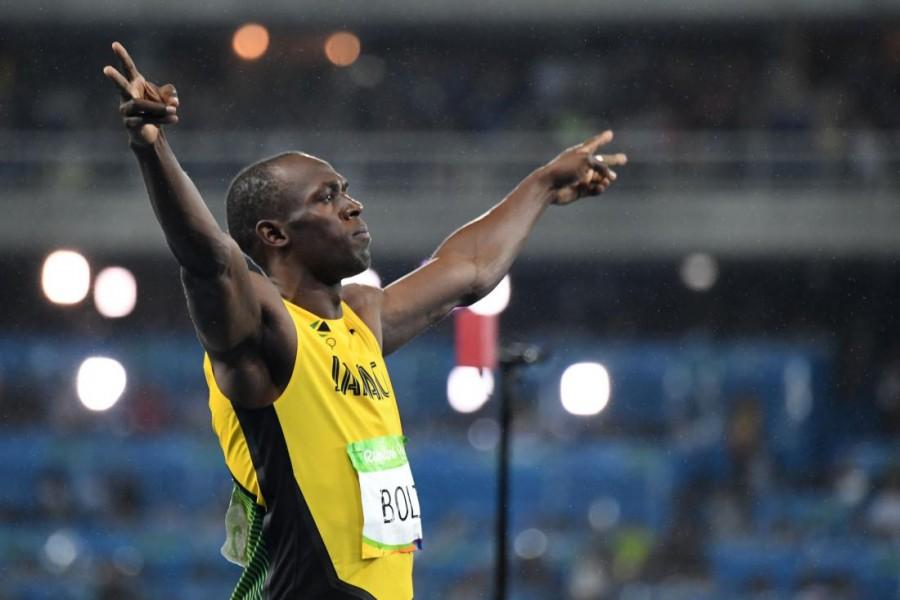 Usain Bolt won the men's 200 metres title at a third consecutive Olympics with a dominant performance and moved another step closer to his target of clinching three gold medals at the Rio Games here. Usain Bolt,Usain Bolt wins 200m title,Rio Olympics,Usain Bolt third consecutive Olympics title,Usain Bolt winner,Usain Bolt pics,Usain Bolt images,Usain Bolt photos,Usain Bolt stills
