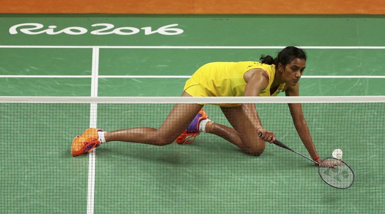 Indian shuttler P.V. Sindhu settled for silver at the Rio Olympics after being beaten 21-19, 12-21, 15-21 by World No.1 Carolina Marin of Spain in the badminton women's singles event here on Friday. It is India's second medal in the Rio Games after wrestler Sakshi Malik bagged bronze in the women's 58 kilogram category on Wednesday. Olympics 2016,PV Sindhu,Badminton,Live Blogs latest Olympics 2016 news