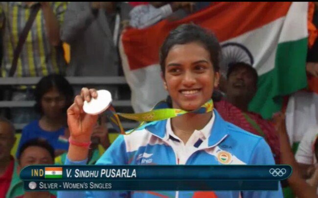 Indian shuttler P.V. Sindhu settled for silver at the Rio Olympics after being beaten 21-19, 12-21, 15-21 by World No.1 Carolina Marin of Spain in the badminton women's singles event here on Friday. P.V. Sindhu,shuttler P.V. Sindhu,Indian shuttler P.V. Sindhu,Carolina Marin,PV Sindhu vs Carolina Marin,badminton women's singles