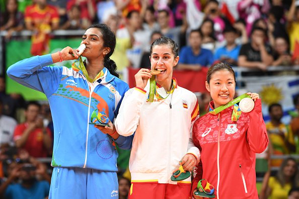 Indian shuttler P.V. Sindhu settled for silver at the Rio Olympics after being beaten 21-19, 12-21, 15-21 by World No.1 Carolina Marin of Spain in the badminton women's singles event here on Friday. P.V. Sindhu,shuttler P.V. Sindhu,Indian shuttler P.V. Sindhu,Carolina Marin,PV Sindhu vs Carolina Marin,badminton women's singles