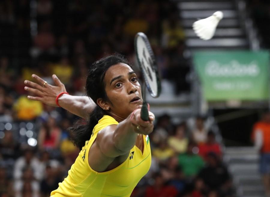 Indian shuttler P.V. Sindhu settled for silver at the Rio Olympics after being beaten 21-19, 12-21, 15-21 by World No.1 Carolina Marin of Spain in the badminton women's singles event here on Friday. It is India's second medal in the Rio Games after wrestler Sakshi Malik bagged bronze in the women's 58 kilogram category on Wednesday. Olympics 2016,PV Sindhu,Badminton,Live Blogs latest Olympics 2016 news