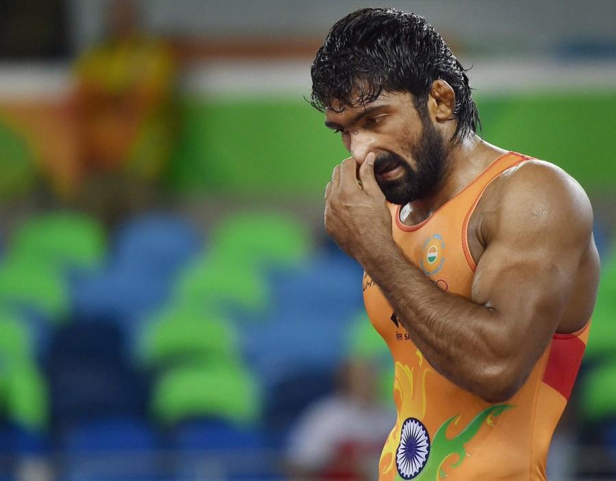 Indian wrestler Yogeshwar Dutt lost his men's freestyle 65 kg qualification match 0-3 against Mongolia's Mandakhnaran Ganzorig at the Rio Olympics here on Sunday. Yogeshwar Dutt.,Indian wrestler Yogeshwar Dutt,wrestler Yogeshwar Dutt,Mandakhnaran Ganzorig,Rio Olympics,Rio Olympics 2016,Rio Olympics pics